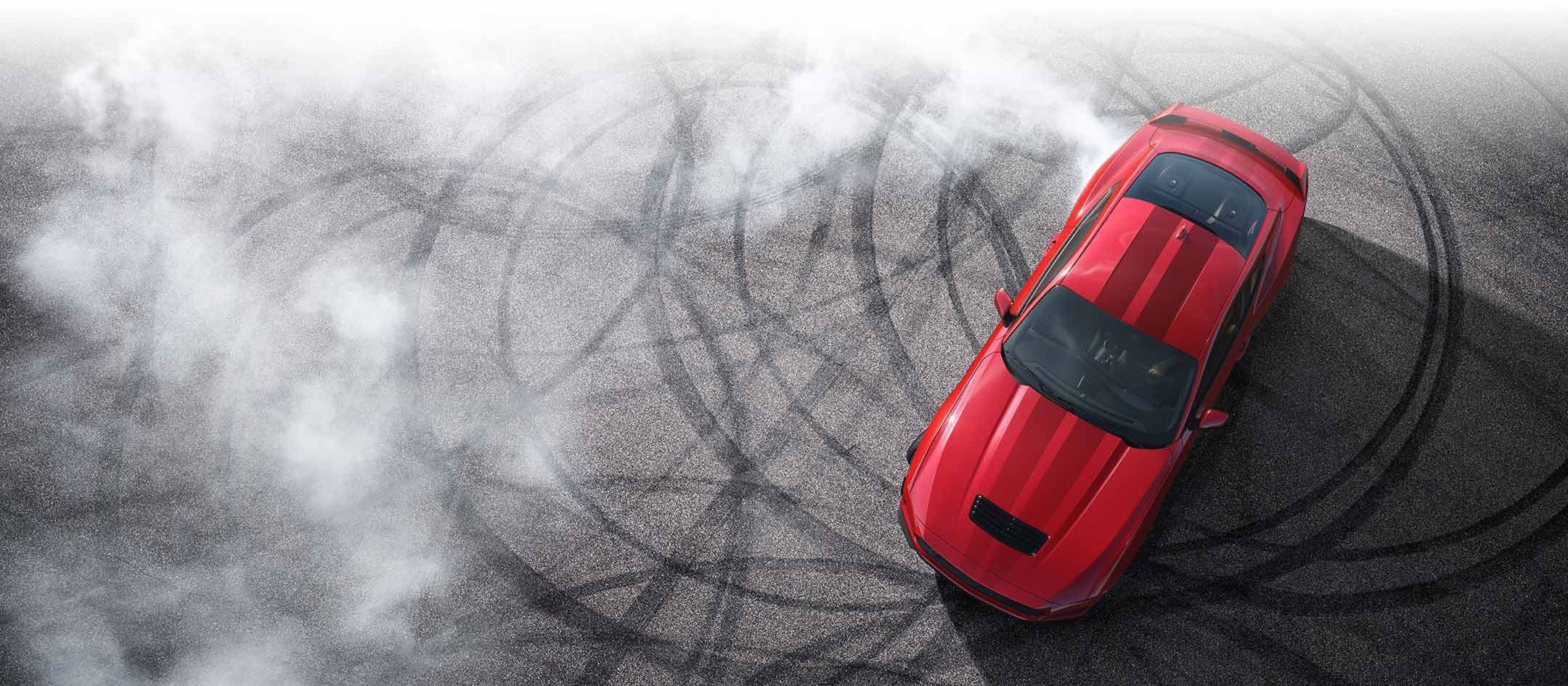 Overhead view of a 2024 Ford Mustang® model with tire tracks on pavement | Paoli Ford in Paoli PA