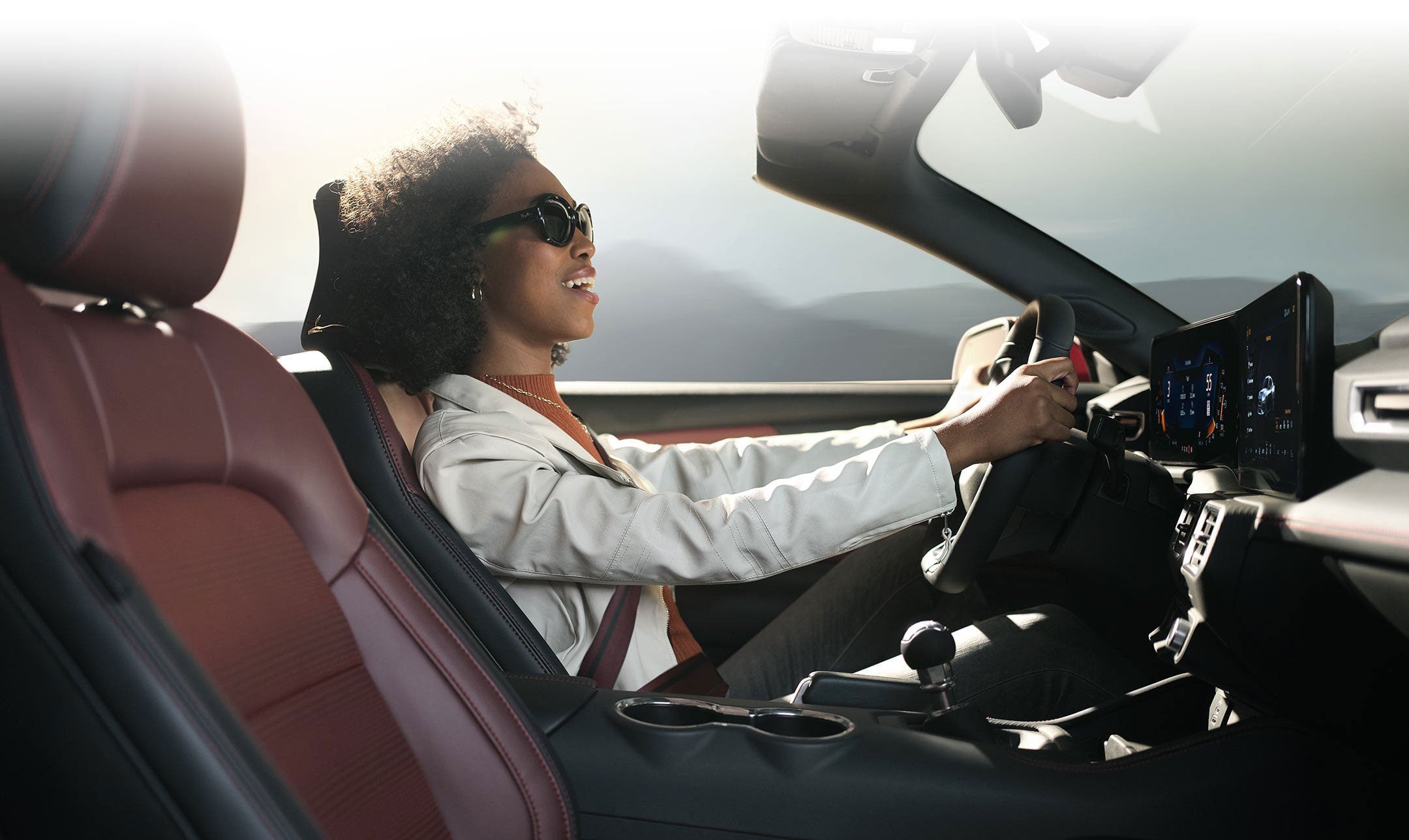 Person sitting in the driver’s seat of a 2024 Ford Mustang® convertible | Paoli Ford in Paoli PA