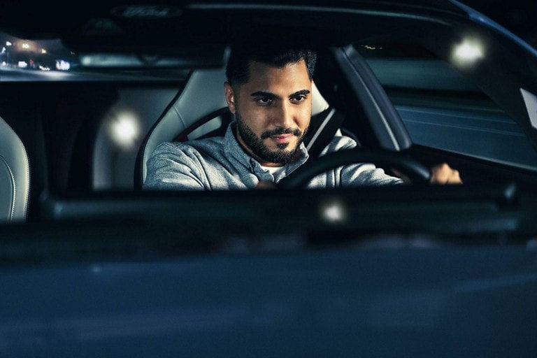 Person sitting in the driver’s seat of a parked 2024 Ford Mustang® coupe | Paoli Ford in Paoli PA